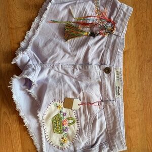 lavender denim shorts come upscale and embellished by Jeanne Prom artist